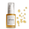 Marula Green Beauty Complexion Tonic Serum bottle alongside golden liquid serum droplets on a white background.
