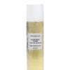 Flat lay view of Marula Green Beauty Glow Reset Toner bottle featuring golden liquid, white cap, and clear toner liquid drops on a clean white background.