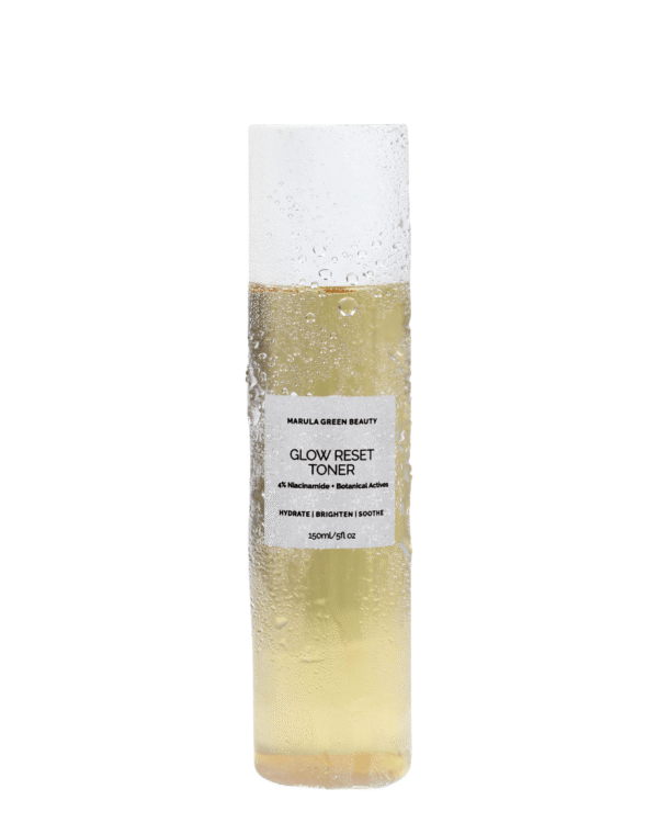 Flat lay view of Marula Green Beauty Glow Reset Toner bottle featuring golden liquid, white cap, and clear toner liquid drops on a clean white background.