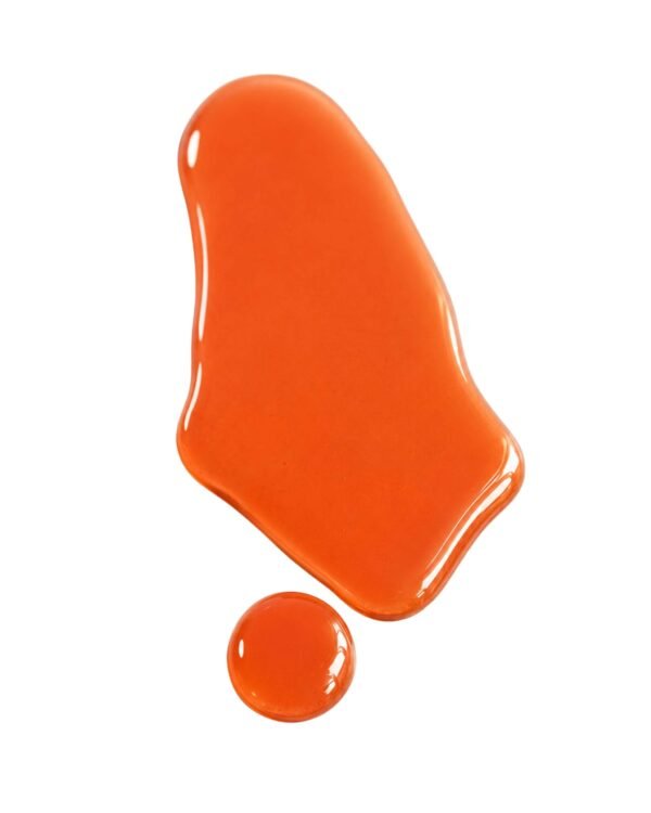 Vibrant orange liquid texture swatch and droplet of Fade Face Oil serum