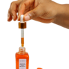 Hand dispensing Fade Face Oil serum with glass pipette dropper