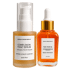 Marula Green Beauty facial skincare set featuring a 30ml frosted glass bottle of Complexion Tonic Serum with a white pump cap next to a 30ml clear glass bottle of golden Fade Face Oil with a dropper top.