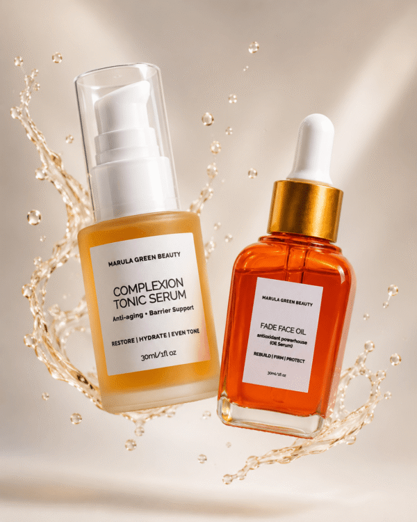 Two 30ml skincare bottles from Marula Green Beauty floating mid-air surrounded by glowing liquid splashes and droplets. On the left is the Complexion Tonic Serum in a frosted glass pump bottle; on the right is the Fade Face Oil in an amber glass bottle with a gold dropper top.
