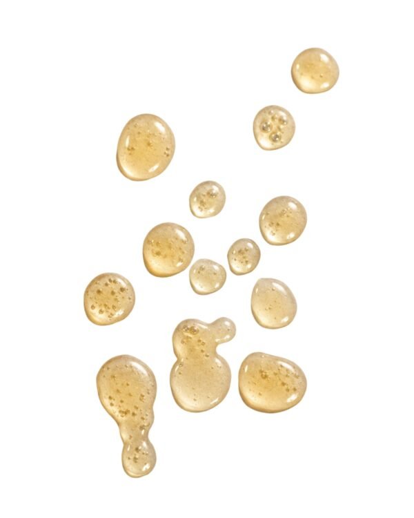 Hydrating golden facial serum swatches and liquid droplets of Marula Green Beauty Complexion Tonic Serum