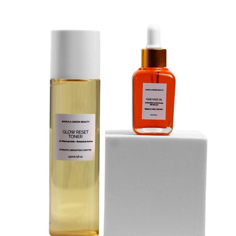 Marula Green Beauty Glow Reset Toner and Fade Face Oil displayed together in an elevated product arrangement, with the toner standing beside a white pedestal and the orange-tinted face oil positioned on top, against a clean white background.